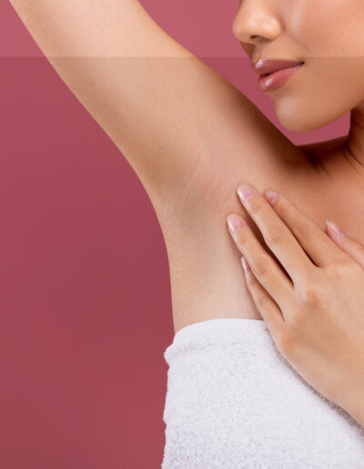 unrecognizable woman lifting hand up, showing clean and hygienic armpits